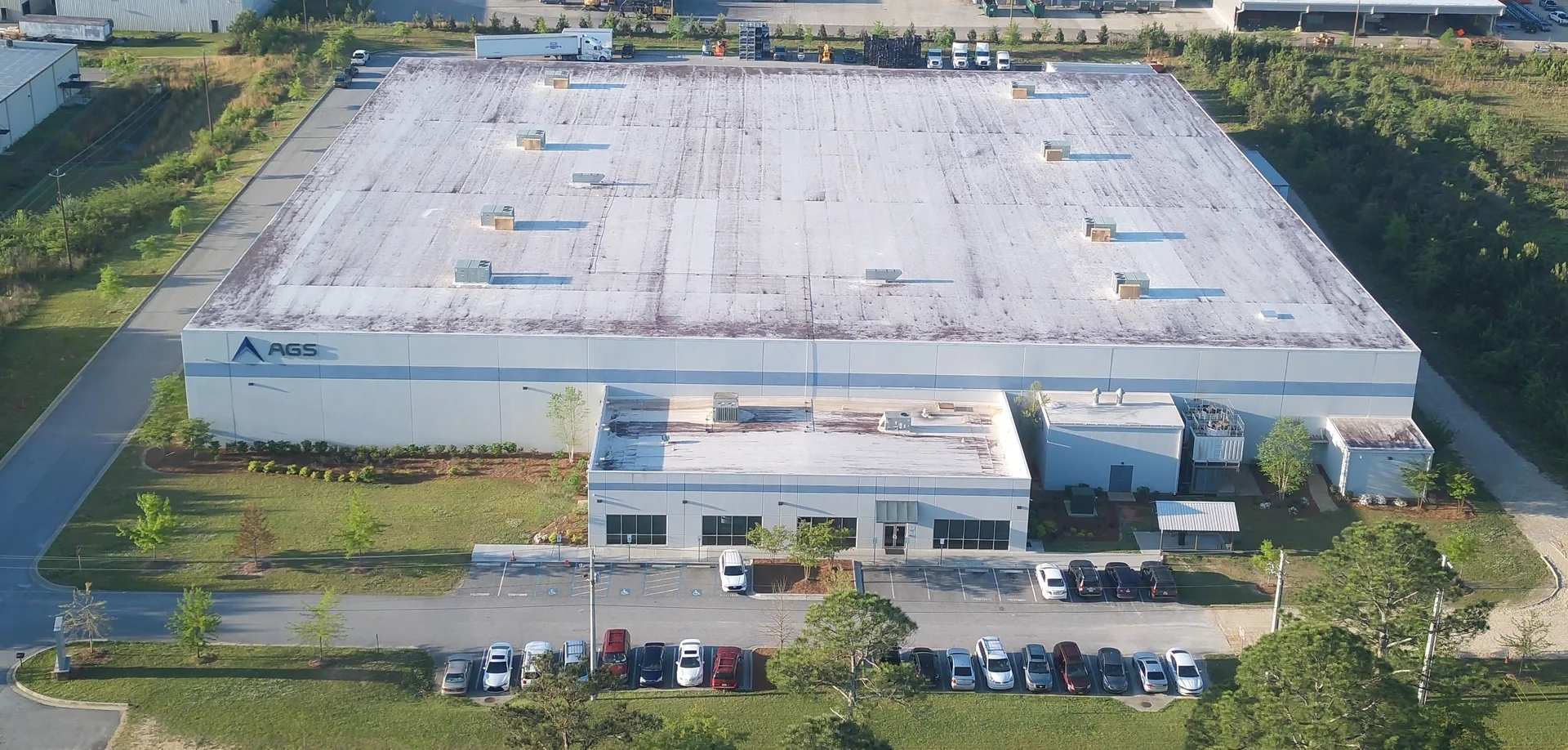 AGS America manufacturing facility exterior in Opelika, Alabama